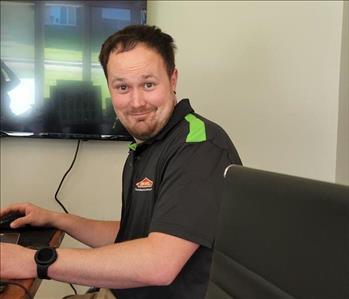 A Servpro co-owner sitting at the meeting table.